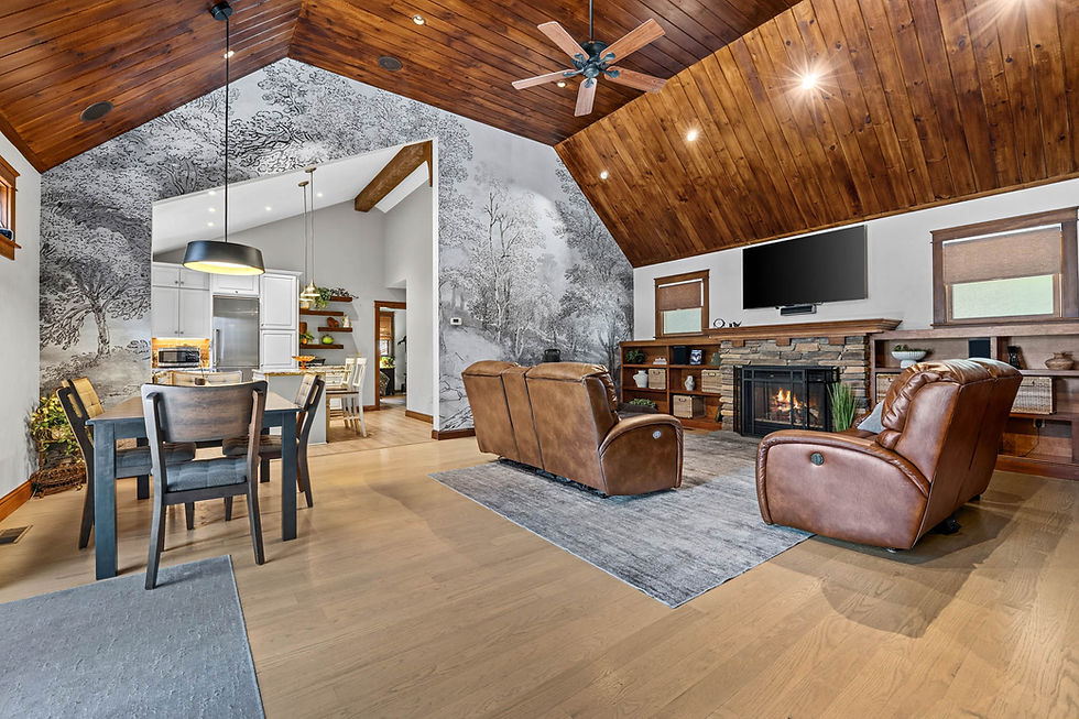 Eye-level view of an updated eat-in kitchen with warm cabinetry and space for casual dining