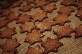 Beautiful freshly baked gingerbread cookies on pan just taken out from oven