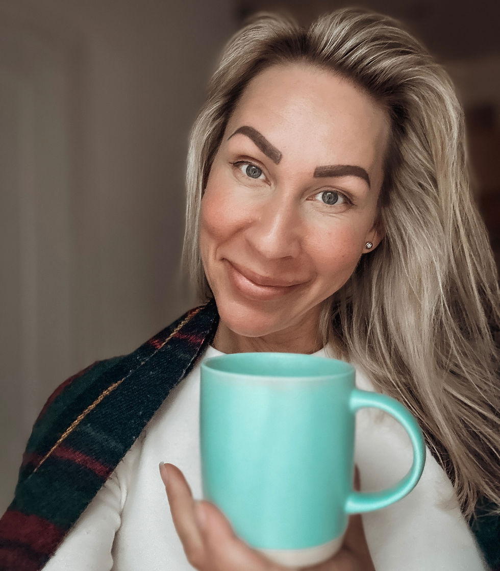 Lady smiling in camera warmly and sincere, holding a tea cup in her hands