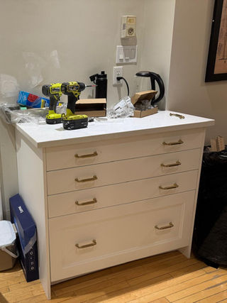 IKEA kitchen cabinet levelling and alignment during installation in Edmonton.