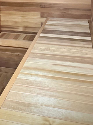 Professionally installed cedar sauna benches with balanced spacing for efficient heat distribution.