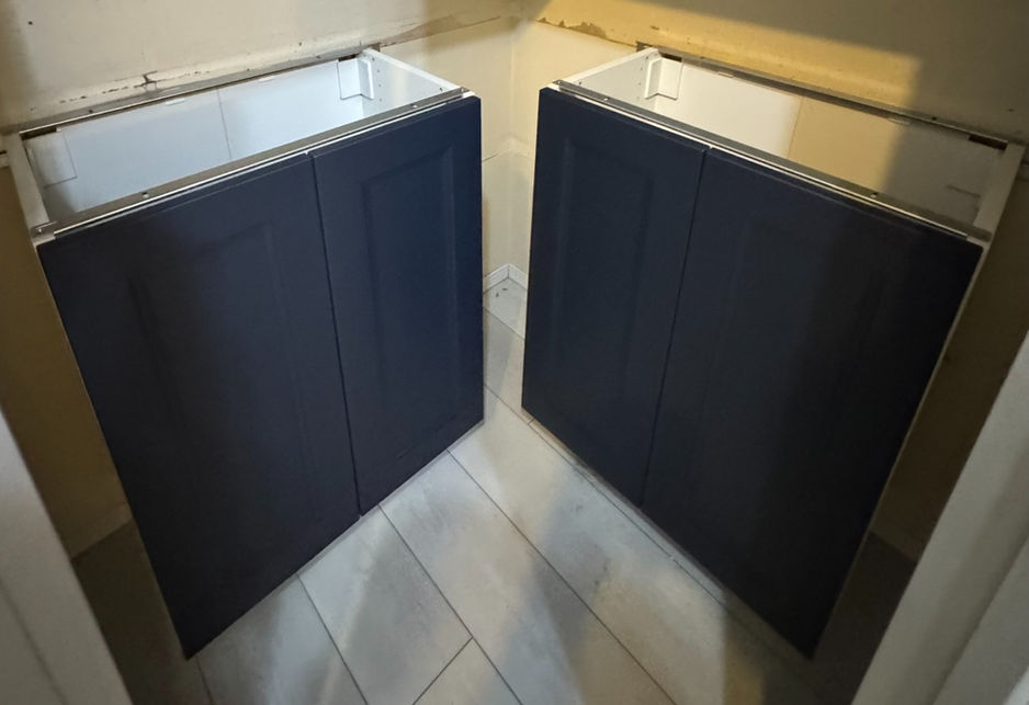 Custom navy blue IKEA pantry cabinets assembled and installed in St. Albert