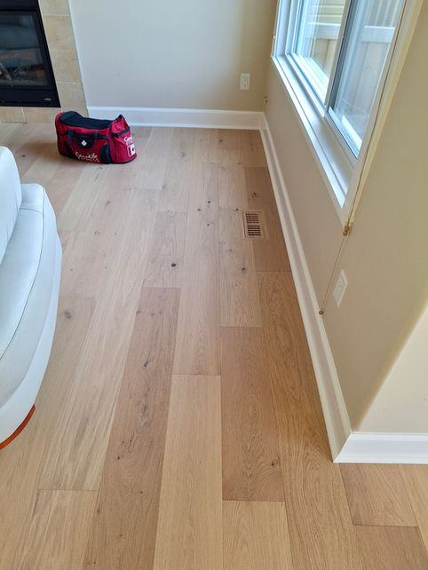 Door casing and baseboard trim installation in Edmonton home