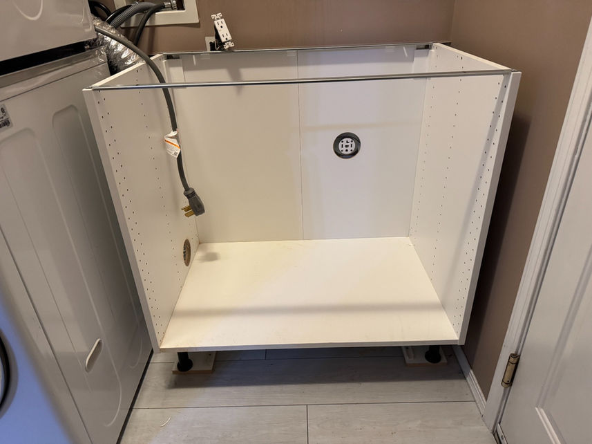 Custom laundry cabinet assembly and installation in St. Albert