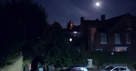 a cityscape under moonlight