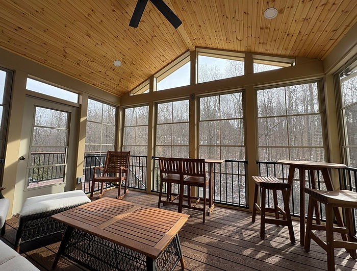 Custom deck and screened porch designed for outdoor entertaining in the Charlotte area