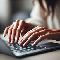 DALL·E 2024-11-11 21.39.33 - A close-up image of a woman's hands typing on a laptop keyboa