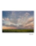 Panoramic Flint Hills sunset print with soft clouds and faint rainbow over Kansas tallgrass prairie, unframed print display