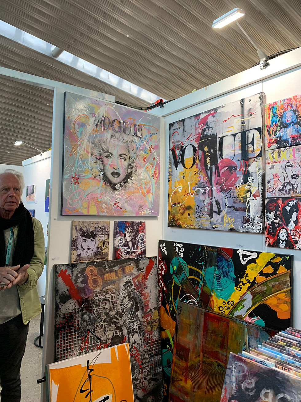 a cluttered art booth