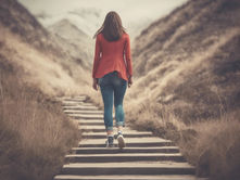 A woman walking up steps in nature