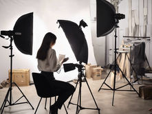 A woman sitting behind the scenes