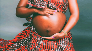 pregnant woman posing in traditional clothing