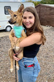 Rescue puppy with their new owner on adoption day after finding loving a forever home through AA Dog Rescue