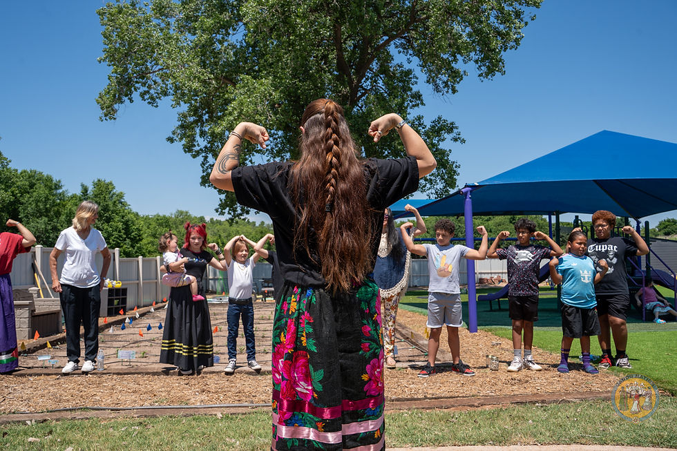 River Whittle plays Simon Says with Caddo Children while saying the Caddo phrase for "May you grow tall & strong"