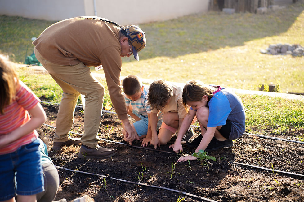 Leonard Kionute showing young Caddo's where to lay seed