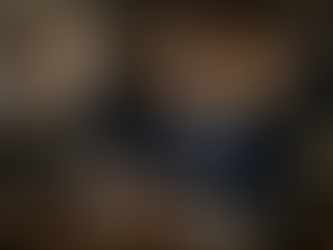 elegant man with laptop in an office