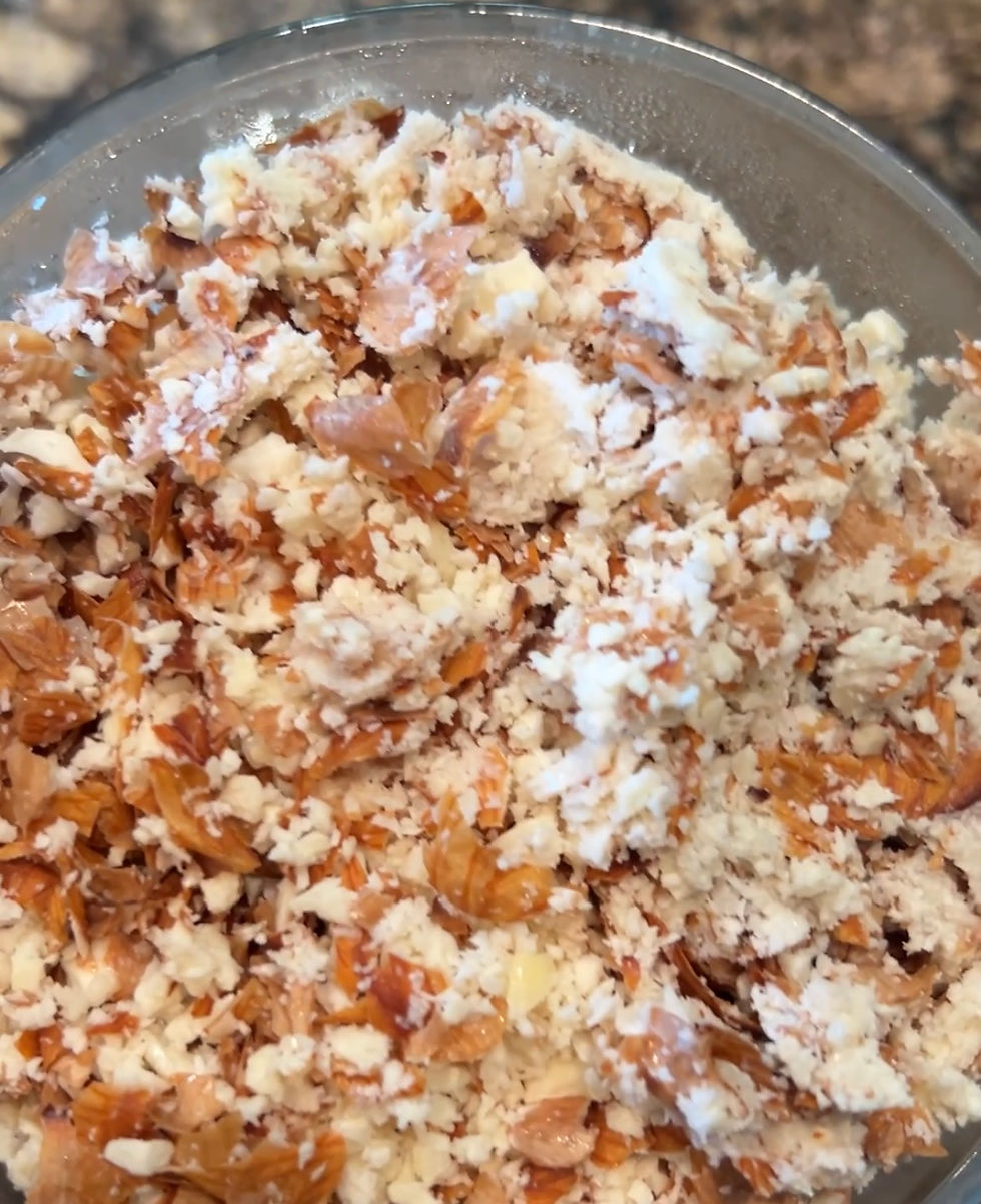 Place dried almond pulp into a bowl