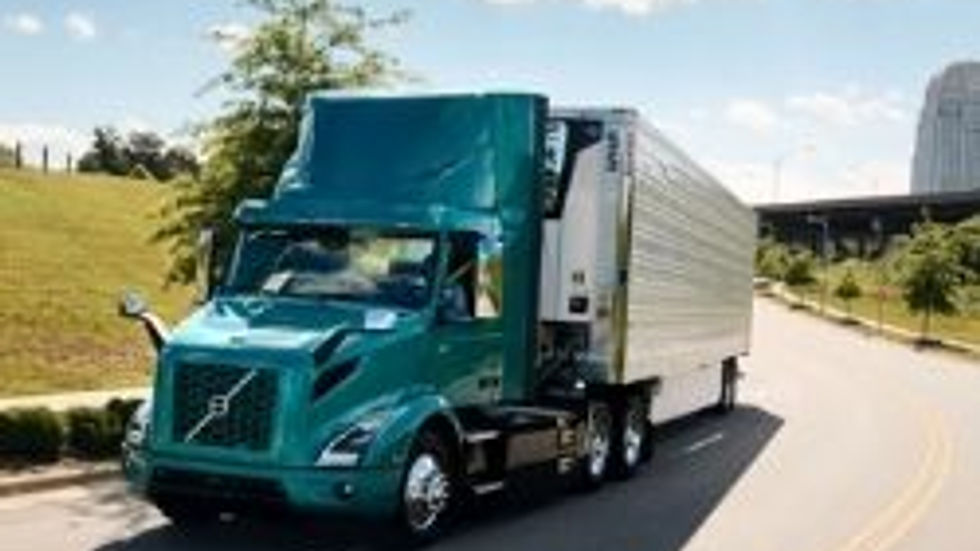 Electric semi truck driving on a highway, highlighting eco-friendly freight and reduced carbon emissions