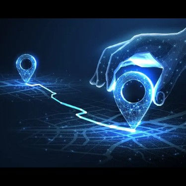 Digital hand moving location pins on a glowing map, representing AI-powered route optimization, real-time tracking, and smart logistics with Amous TMS.