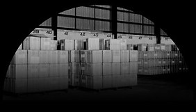 Logistics warehouse interior showing freight storage and outbound shipments, representing supply chain visibility and TMS automation.