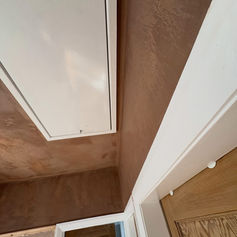 Smooth plastered ceiling and wall in a finished room