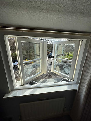 Open timber casement windows fitted during a property renovation