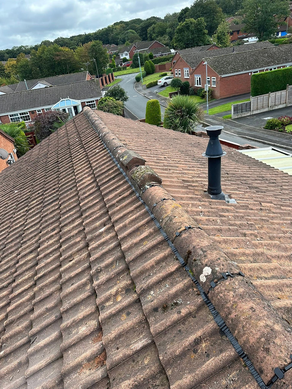Roof tiles and ridge line with soil vent pipe fitted on residential property
