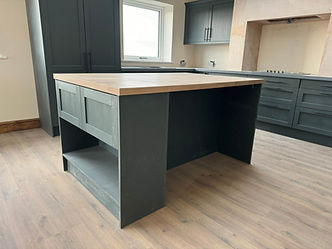 Bespoke grey kitchen island with solid wood worktop and open shelving