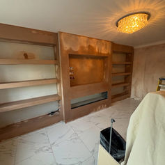 Alcove with built-in shelving and a ceiling light