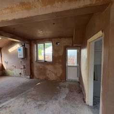 Room with newly plastered walls and a window