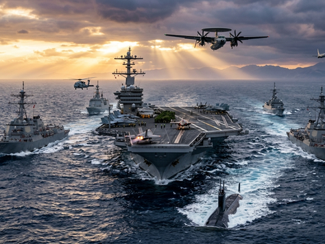 Modern Aircraft Carrier Strike Group featuring an aircraft carrier escorted by destroyers, frigates, submarines and carrier-based aircraft operating in formation at sea.