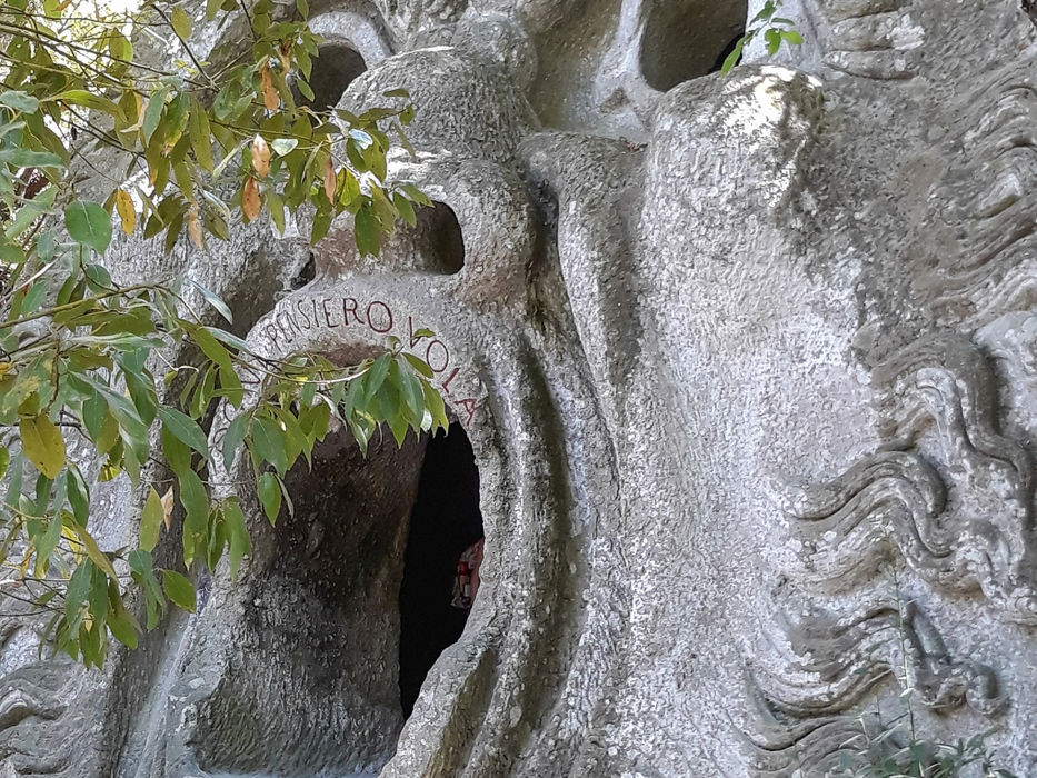 The Mouth of Orcus sculpture in the Sacred Wood of Bomarzo with its large open mouth entrance in Lazio, Italy.
