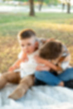 two brothers posed together about to tickle each other during a photoshoot at Morrison Ranch in Gilbert Arizona