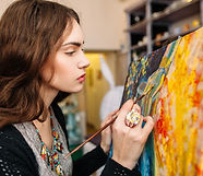 Creative painter paints a colorful pictu