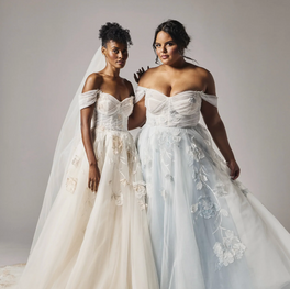 Hand-embroidered 3D organza florals and vines cascade over a tulle and organza skirt and sculpted, supportive corset.