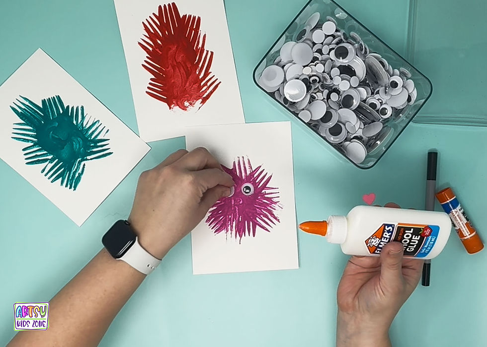 Glueing googly eyes onto monsters.