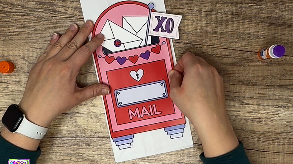 Gluing Mailbox to paper bag.