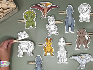 Completed dinosaur clothespin puppets craft.