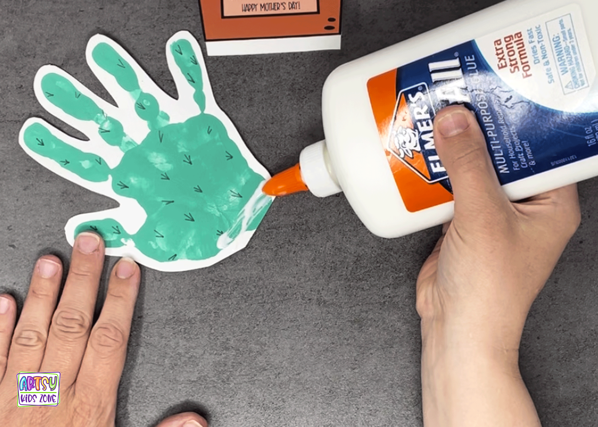 How to glue handprint to the pot shaped card.