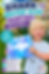 Boy holding his completed shark water gun painting