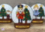 Completed examples of the Nutcracker Snow Globes craft for Kids.