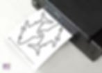 Printing shark outline on sticker paper.