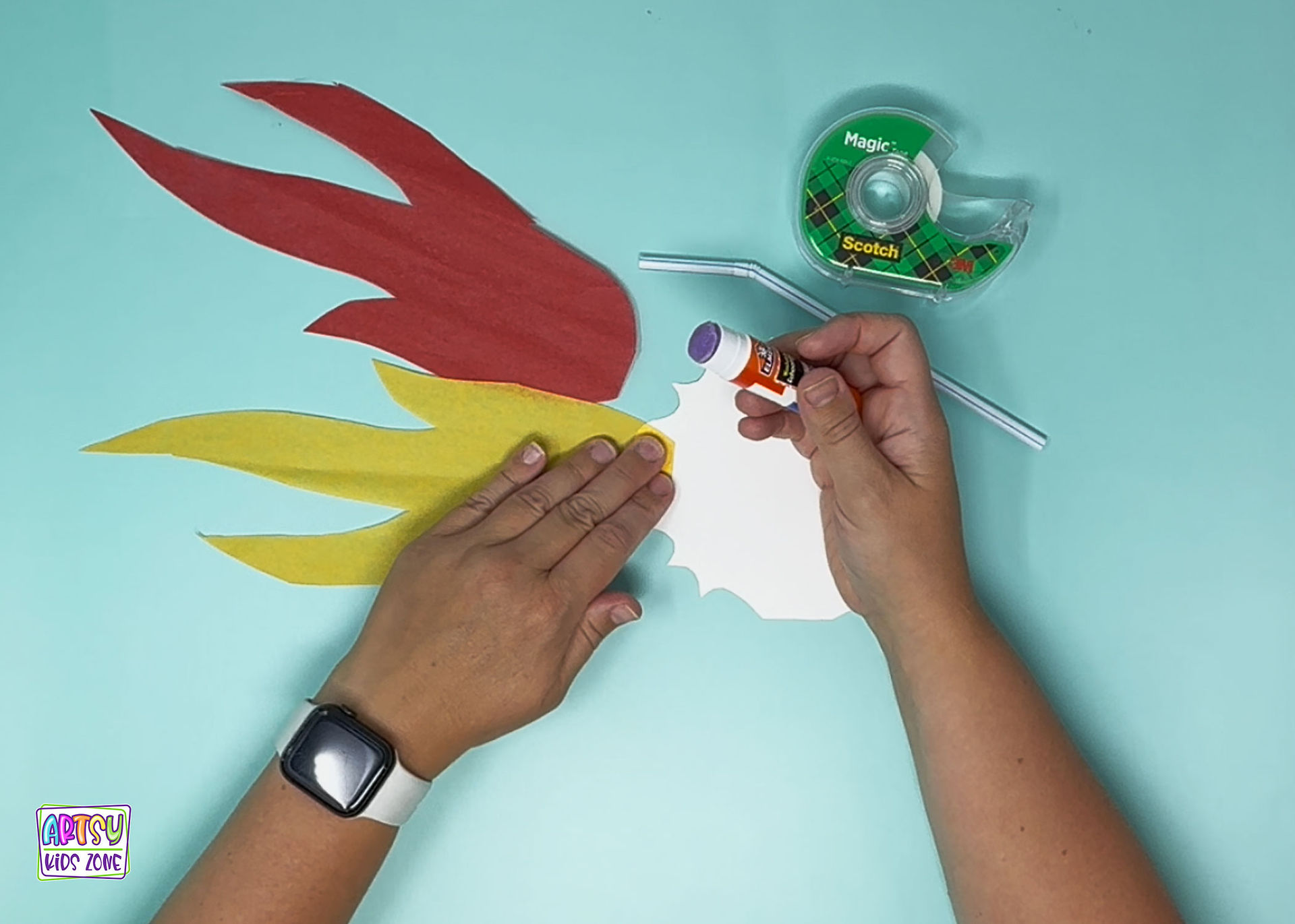 Gluing yellow flame to dragon.