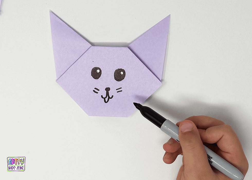 Grab a marker and draw a face on the cat's head.