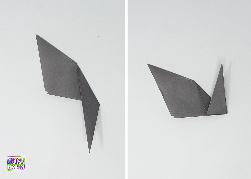 Form the shape of the tail by folding the corner down and then back up.