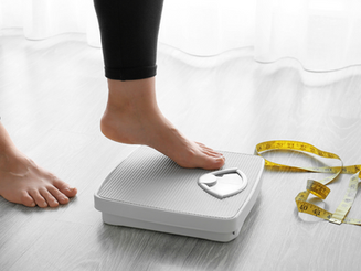 stepping on scales for weight loss