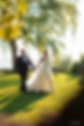Bride and groom walking through a sunlit garden, natural documentary wedding photography in Lebanon