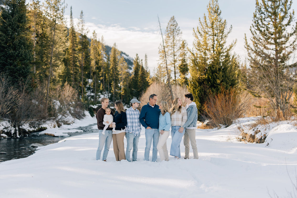 Winter family photography session along a Wyoming river