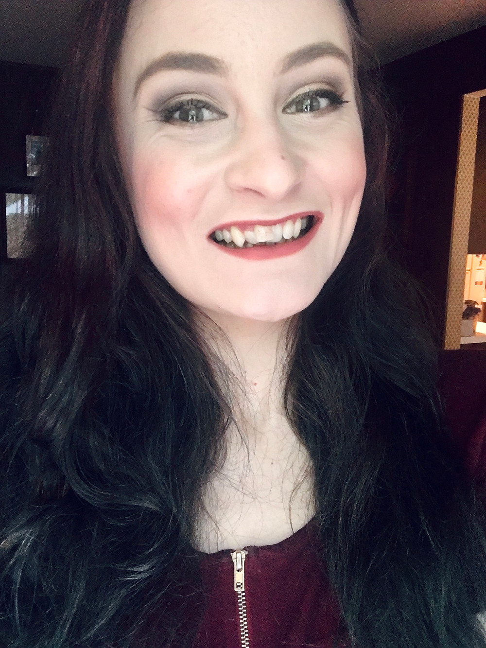 a white girl with crooked front teeth smiling