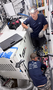 Marine technicians servicing yacht systems